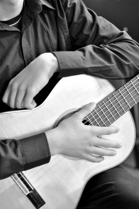 Guitarist playing acoustic music for cremation services Royal Oak, MI memorial tribute