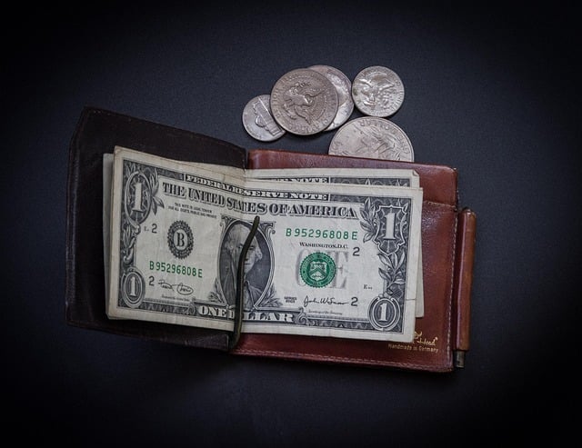 Wallet and cash symbolizing thoughtful funeral planning costs and support in Sterling Heights MI